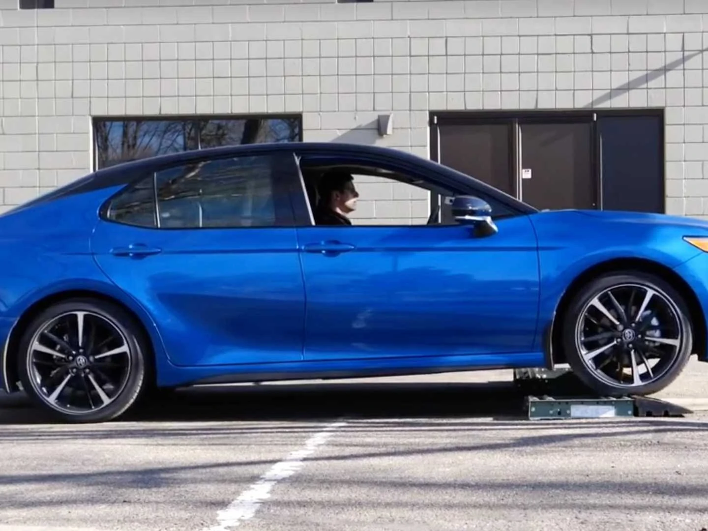 How does the Toyota Camry's AWD system perform with wheels on rollers?